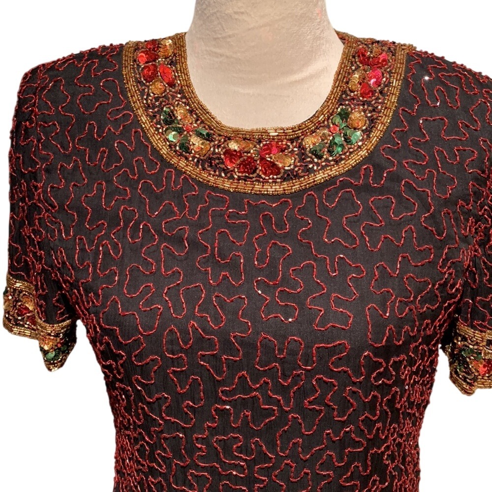 PAPÉLL BOUTIQUE. Evening. Jewel toned top w/details on neckline,collar & hem. S.